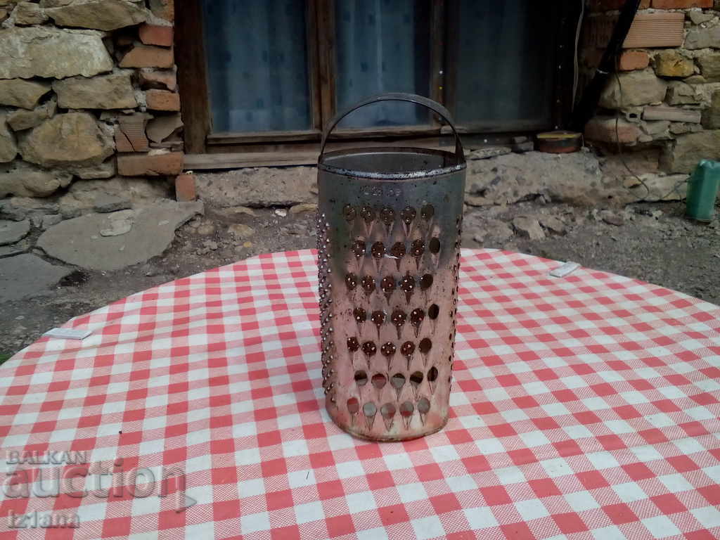 Auction An old kitchen grater Auction An old kitchen grater