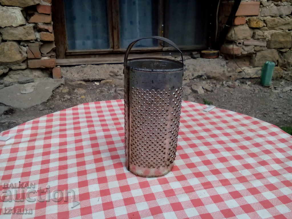 An old kitchen grater An old kitchen grater