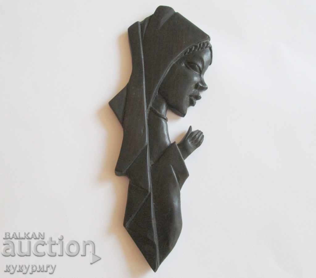 An old wooden religious figure panel carving ebony