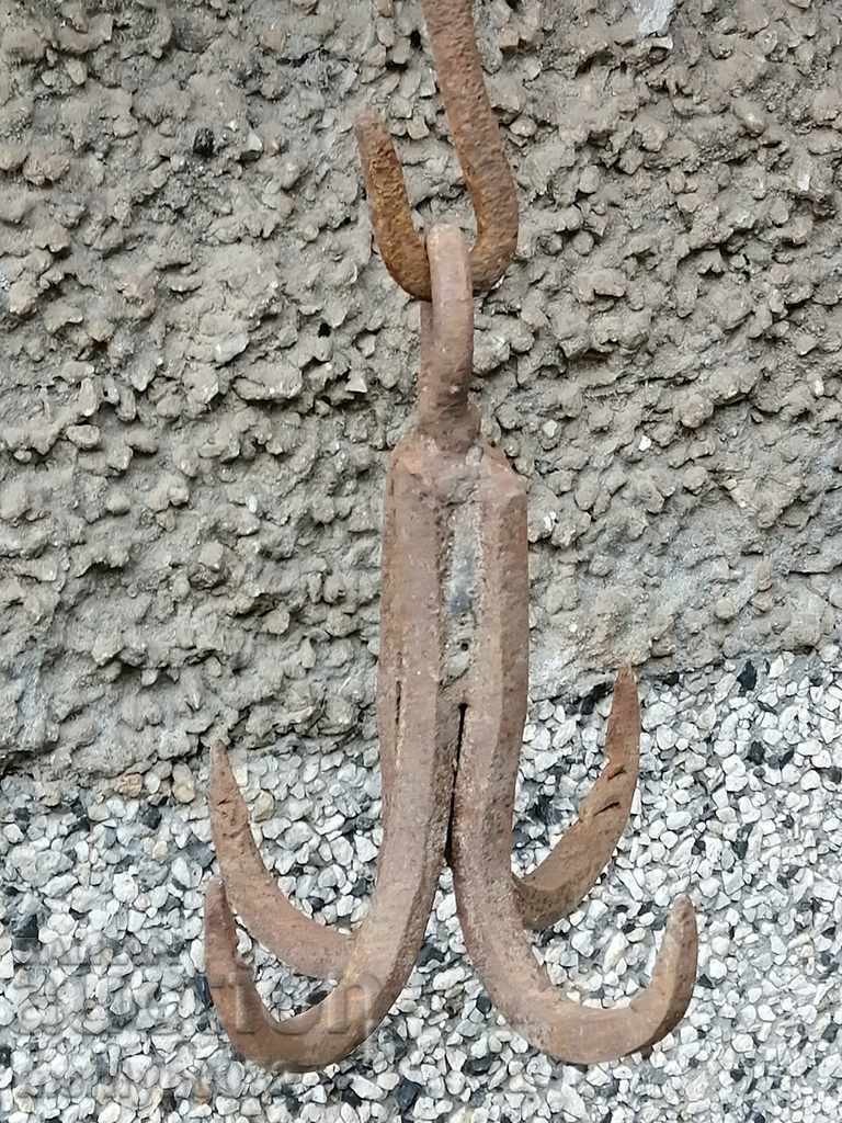 An antique forged hook, quadruple