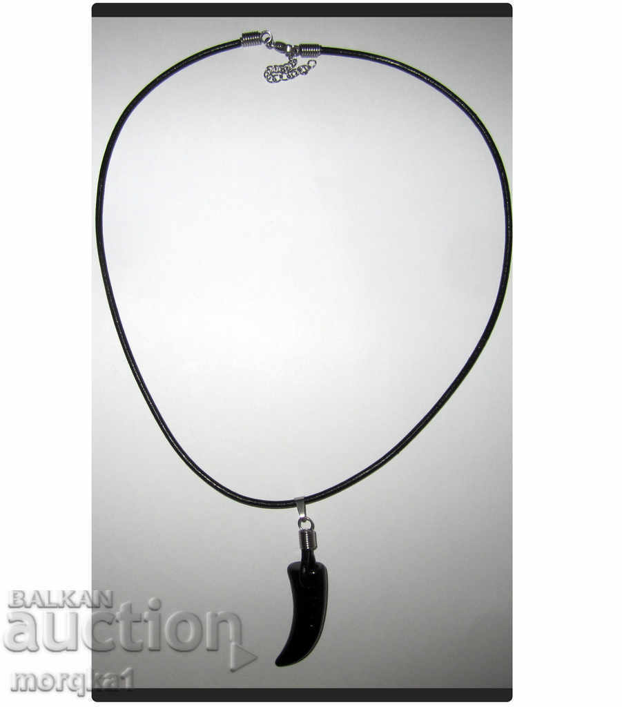 Delivery of Black horn, tooth on a chain of genuine leather and steel Delivery of Black horn, tooth on a chain of genuine leather and steel