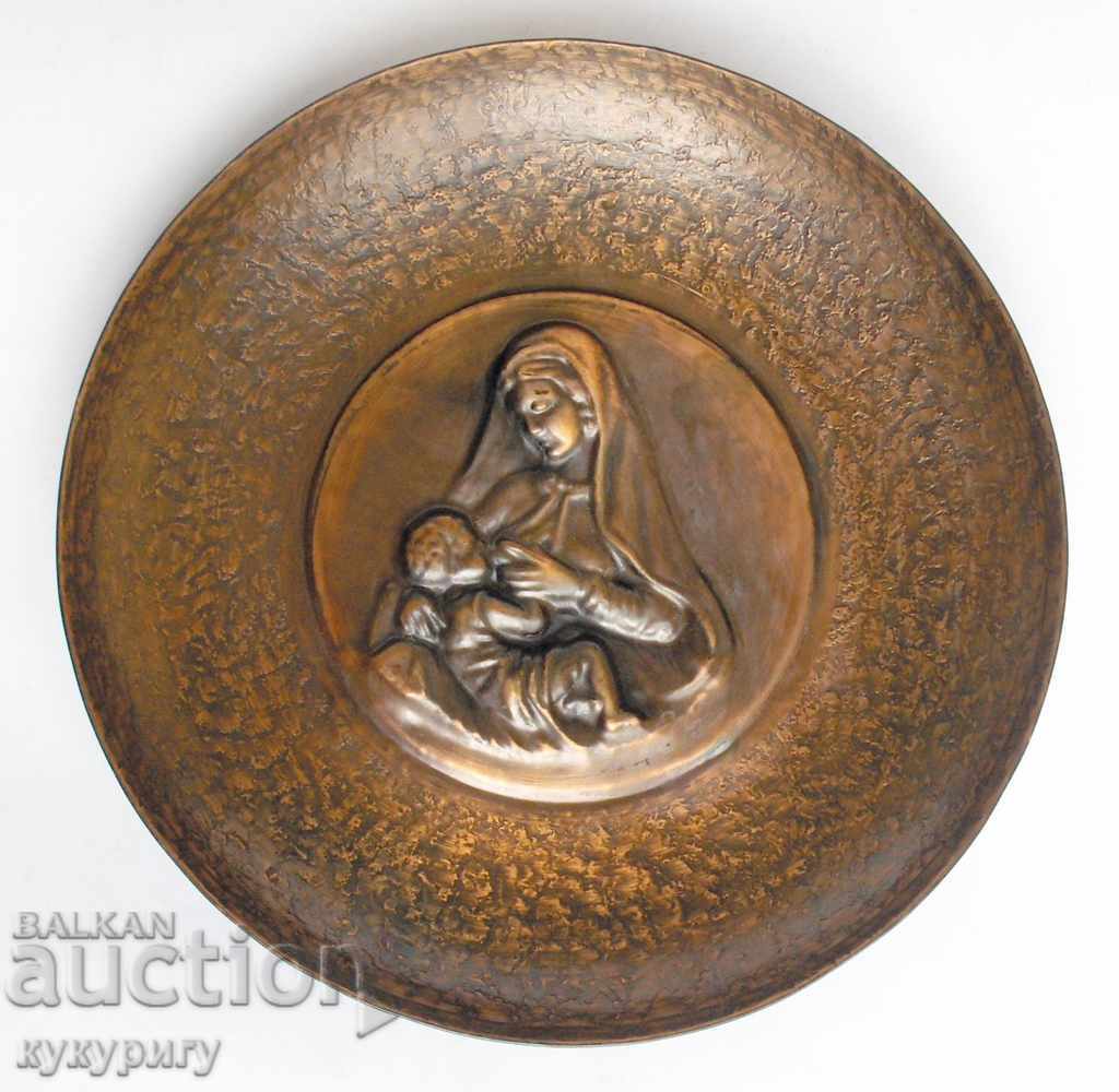 Old religious copper plate wall decoration with Virgin Mary