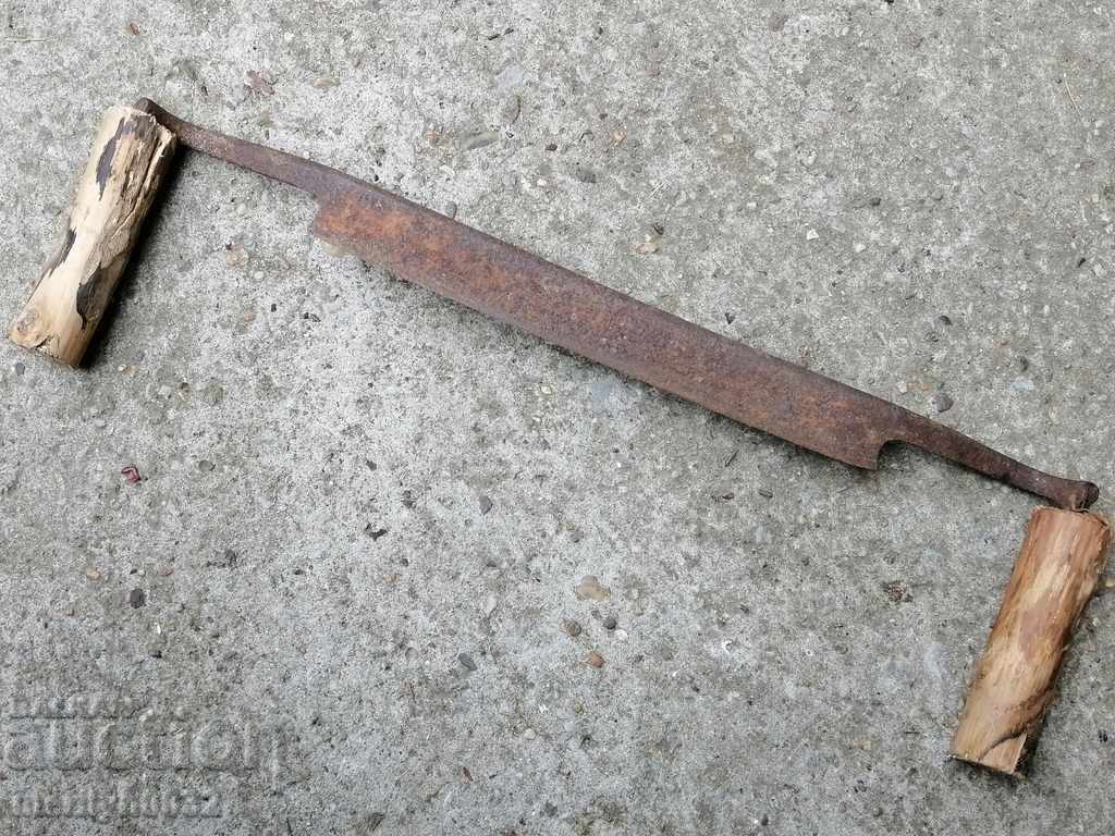 An old carpenter's hand, a tool, a saw, wrought iron - 7