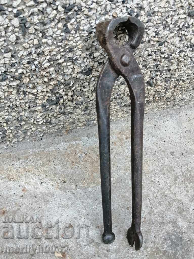 Old tongs, wrought iron, tool corpen