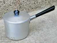 Old frying pan made of aluminum kitchen utensils
