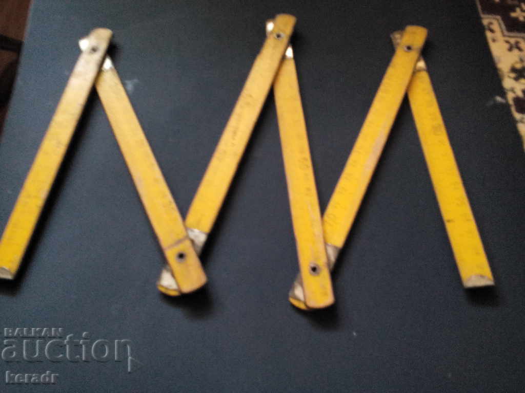 Old carpentry, masonry, wooden meter Old carpentry, masonry, wooden meter