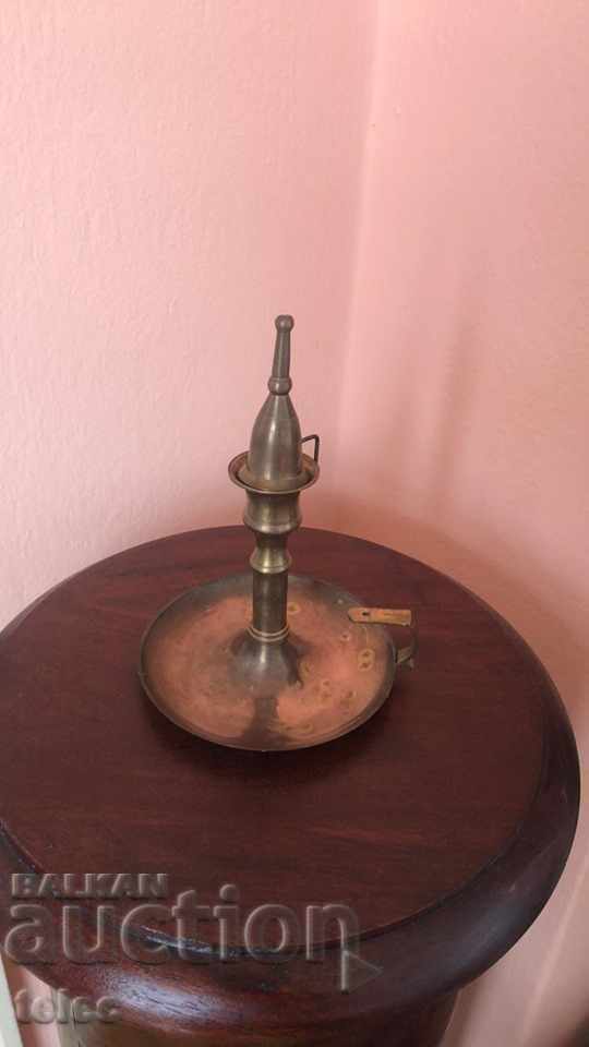 Old candlestick with cap