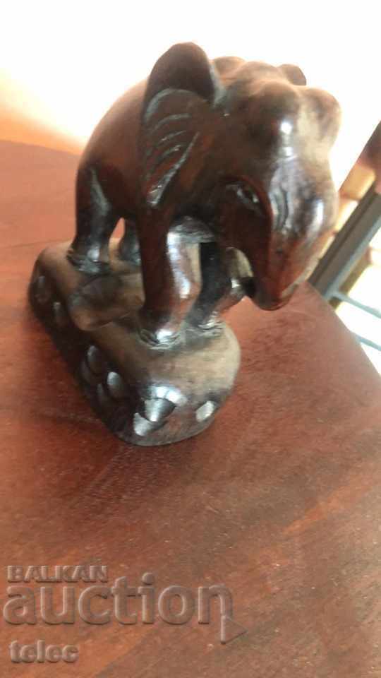 Auction  Wooden elephant on a pedestal