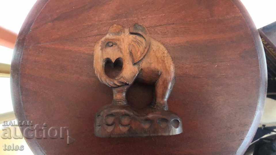 Wooden elephant on a pedestal