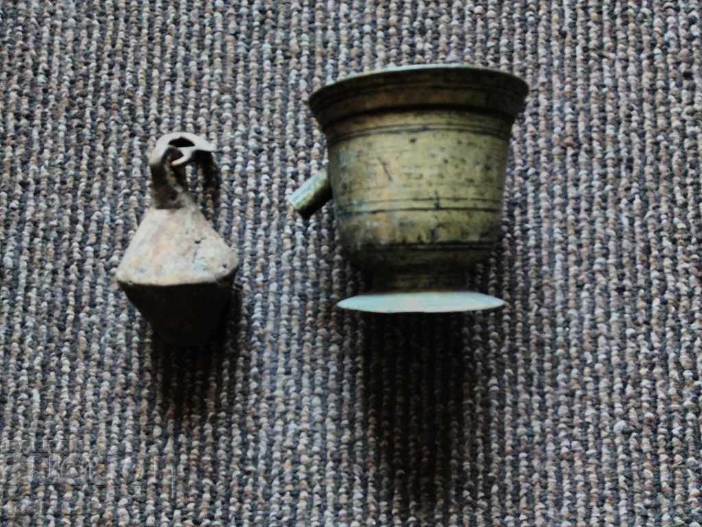 A brass mortar and pestle from an old scale