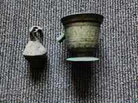 A brass mortar and pestle from an old scale