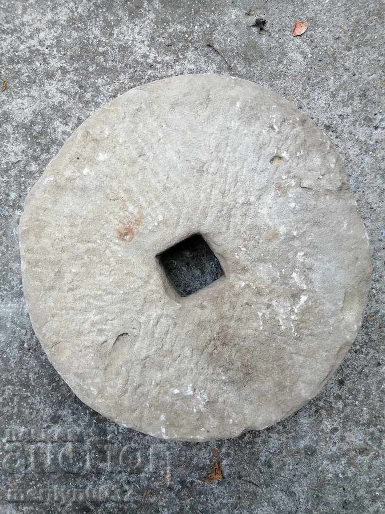 Ancient stone grinder