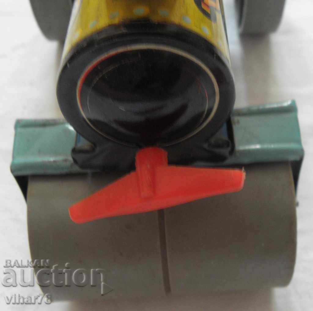 Παράδοση Παιδικό ρολό παιχνιδιών κασσίτερου