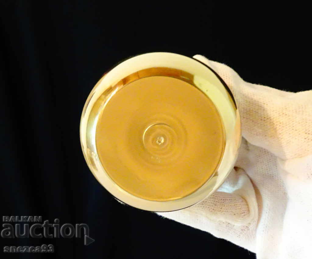 Auction Brass candlestick with openwork hearts. Auction Brass candlestick with openwork hearts.