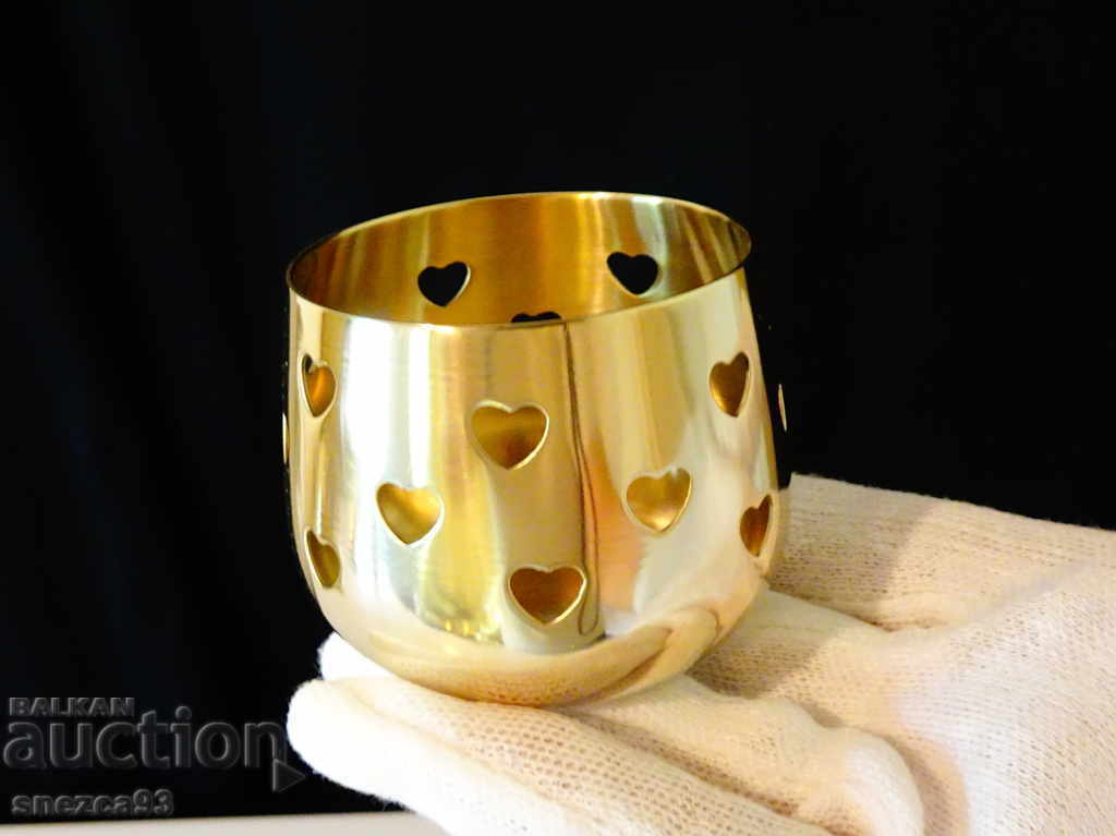 Delivery of Brass candlestick with openwork hearts. Delivery of Brass candlestick with openwork hearts.