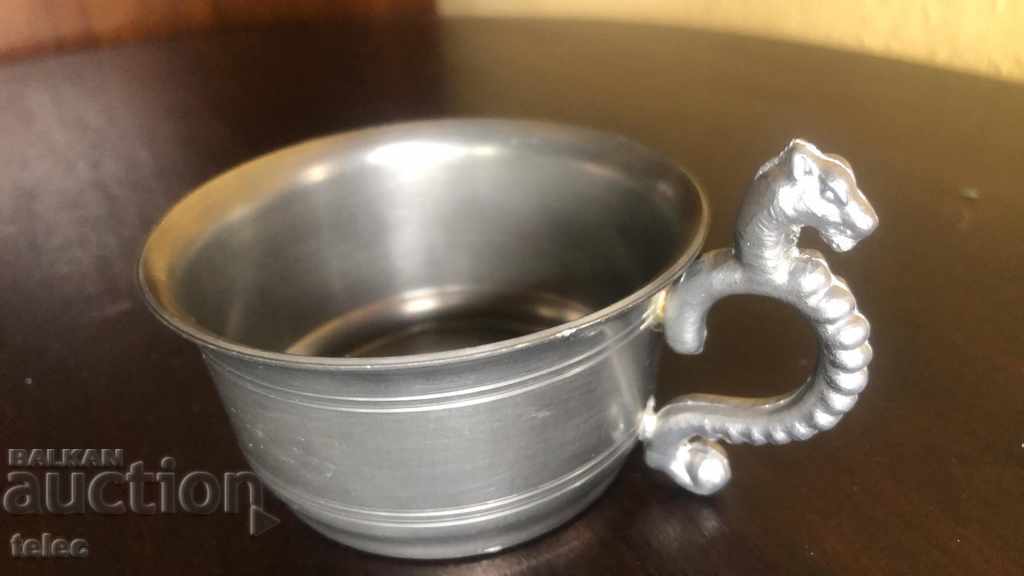 Beautiful metal cup with dragon handle