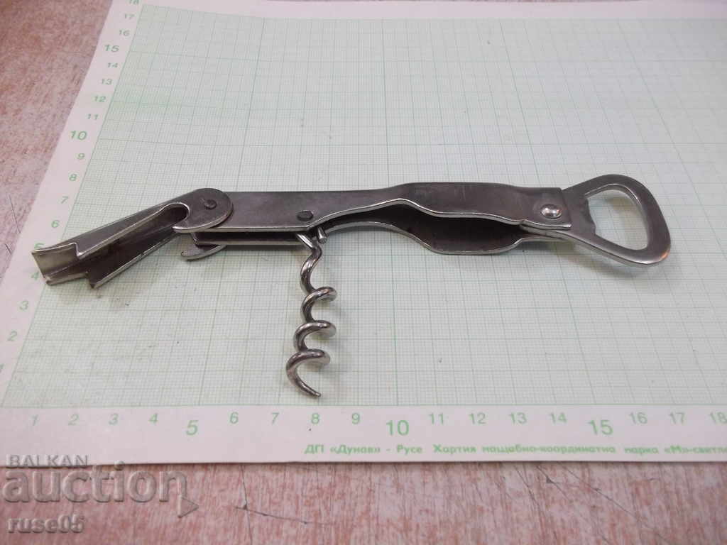 Auction Opener with corkscrew from the sauce - 1 Auction Opener with corkscrew from the sauce - 1