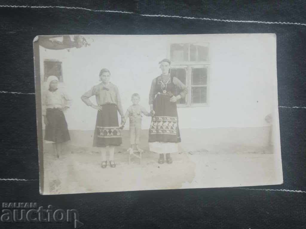 Two women with a child in a car seat Two women with a child in a car seat