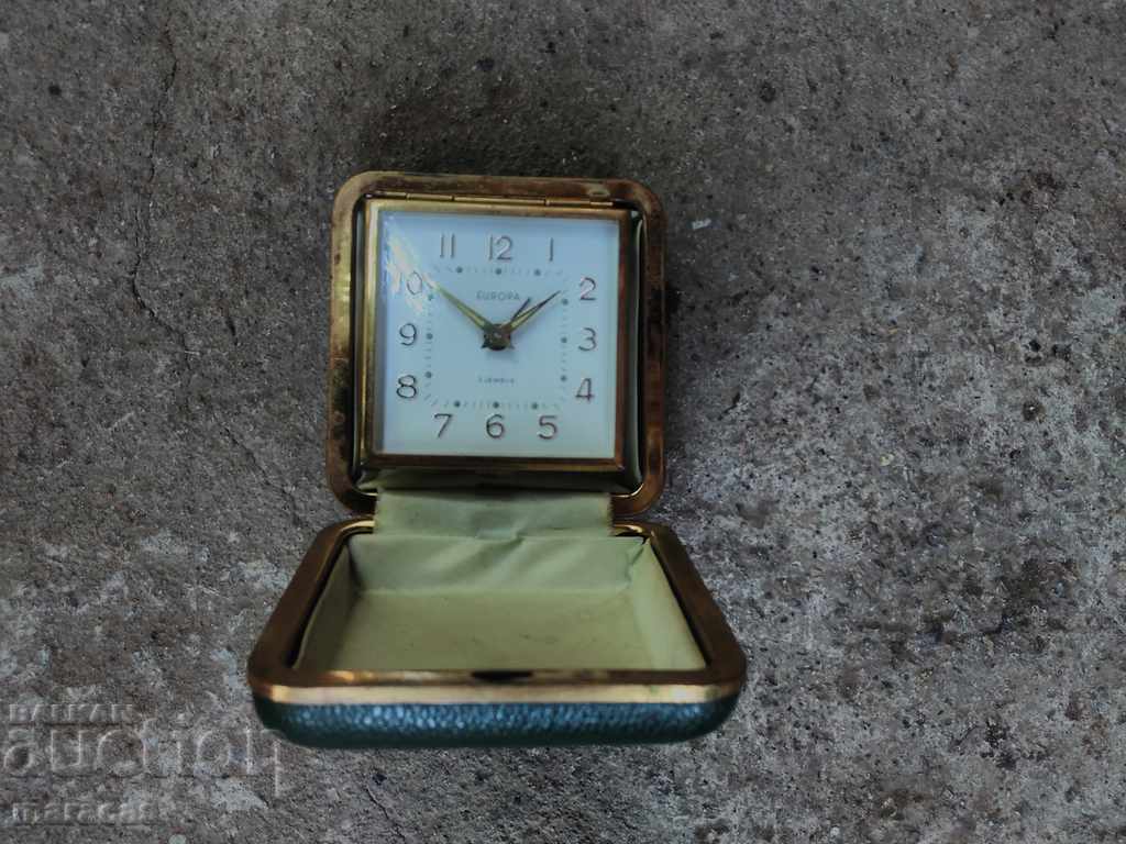 A small alarm clock A small alarm clock