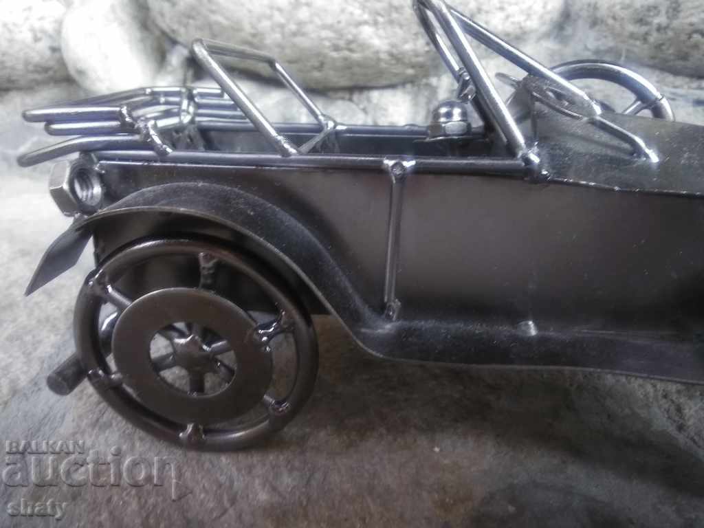 Auction  Large metal retro car.