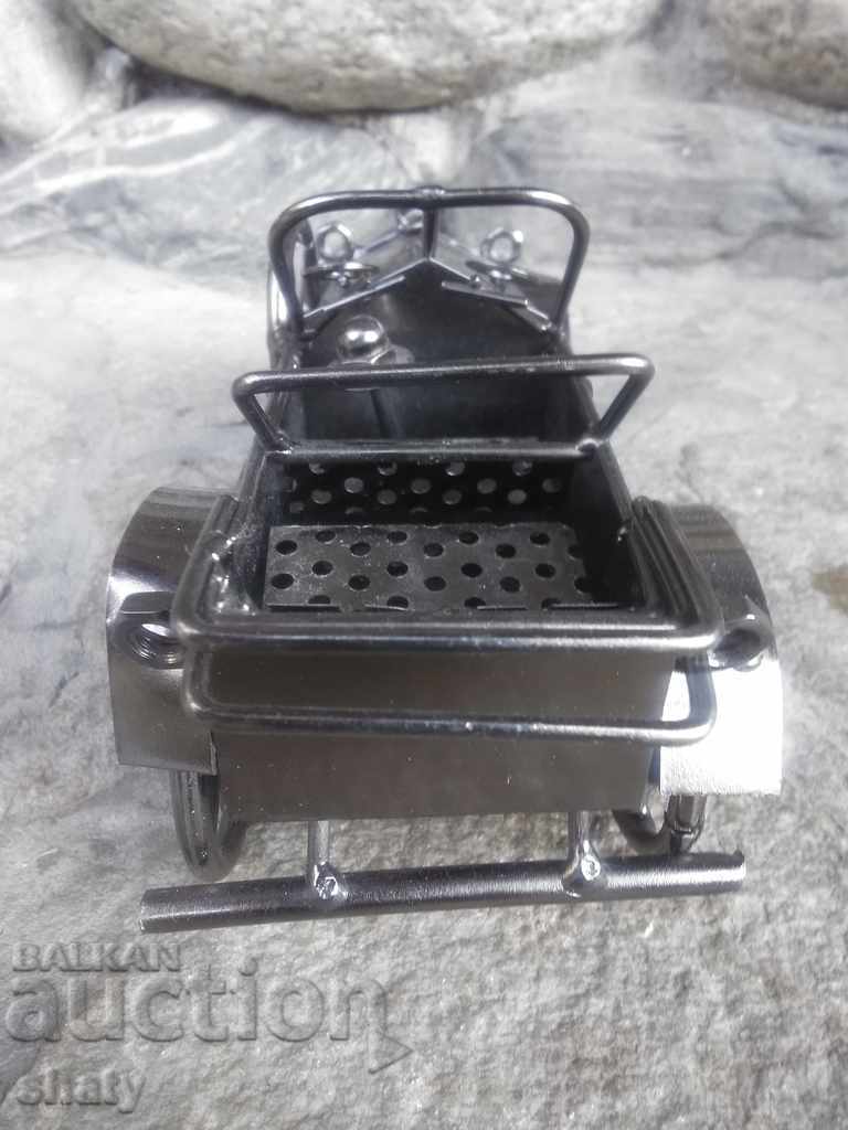 Delivery of Large metal retro car.