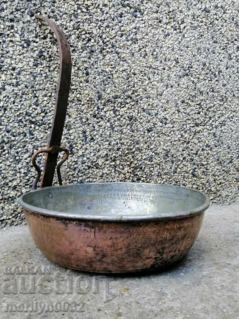 An old copper pan, a baker, a tray, a copper pot