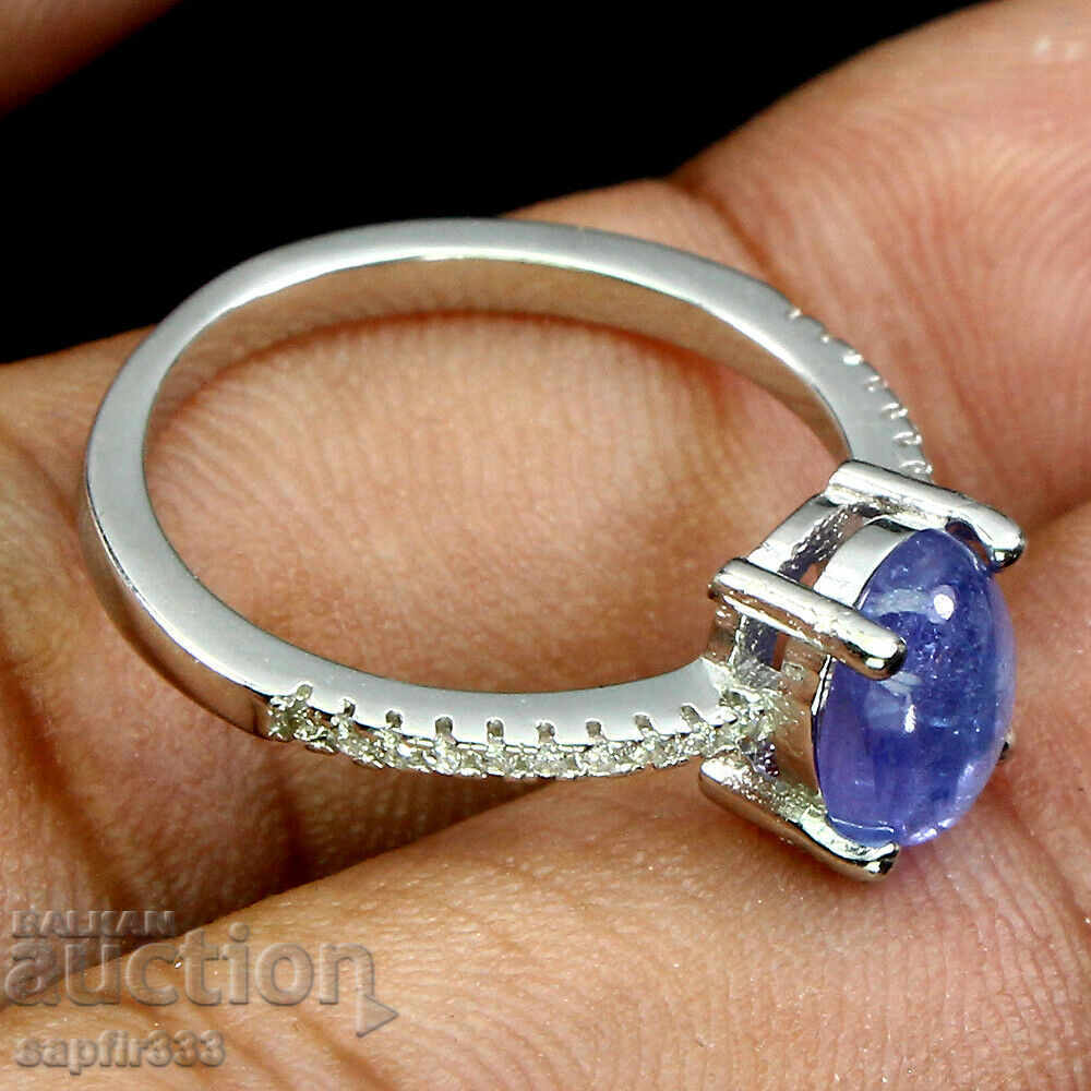Auction ELEGANT RING WITH NATURAL TANSANITE AND ZIRCONI Auction ELEGANT RING WITH NATURAL TANSANITE AND ZIRCONI