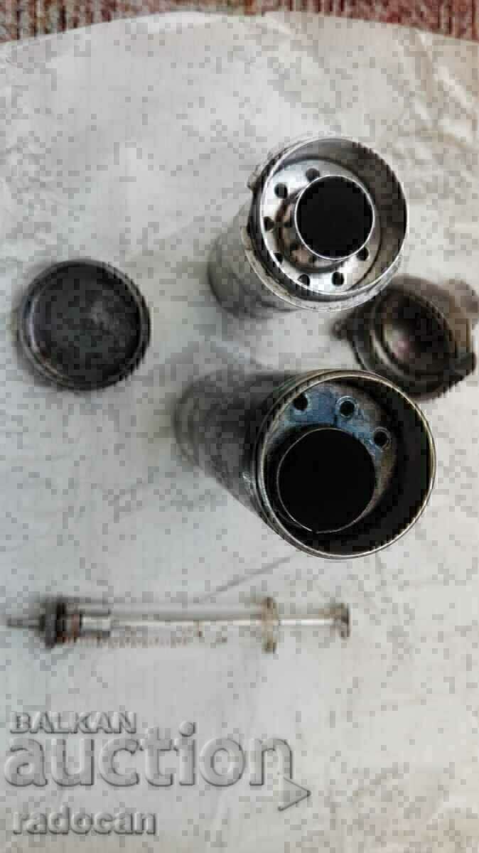 Delivery of Old medical set of syringes, needles and swab containers Delivery of Old medical set of syringes, needles and swab containers