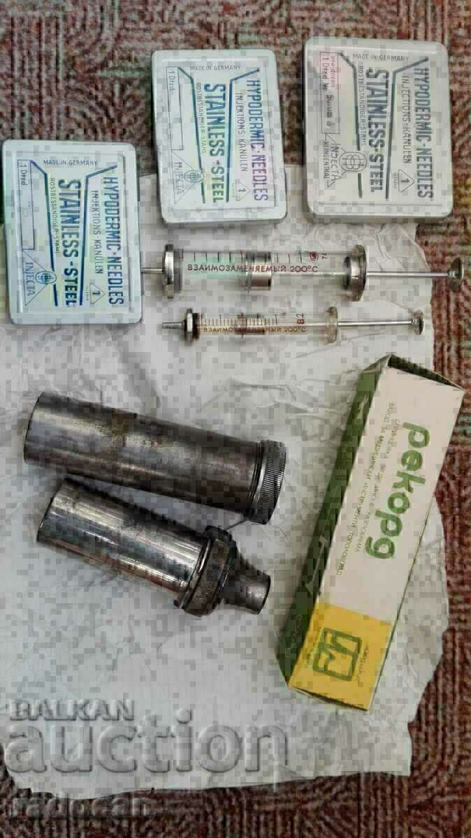 Old medical set of syringes, needles and swab containers Old medical set of syringes, needles and swab containers