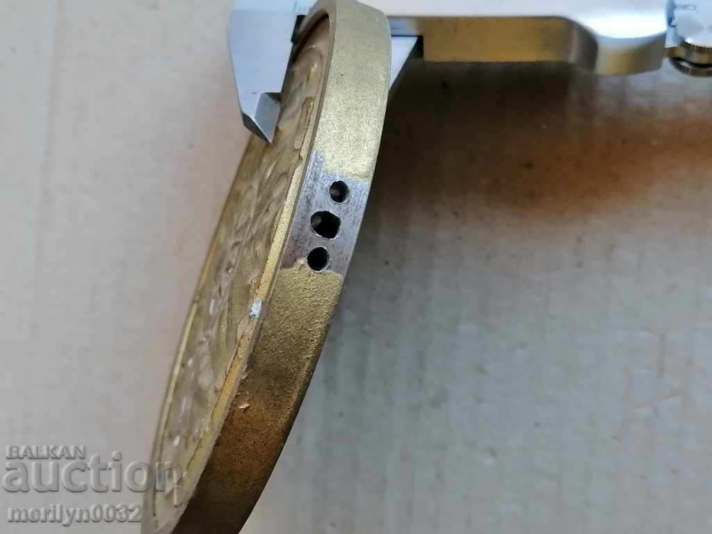 Auction  Pendulum weight from an old wall clock