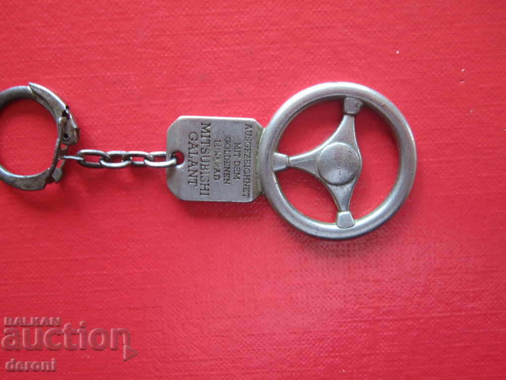 Auction Unique award-winning Golden Handlebar keychain Auction Unique award-winning Golden Handlebar keychain