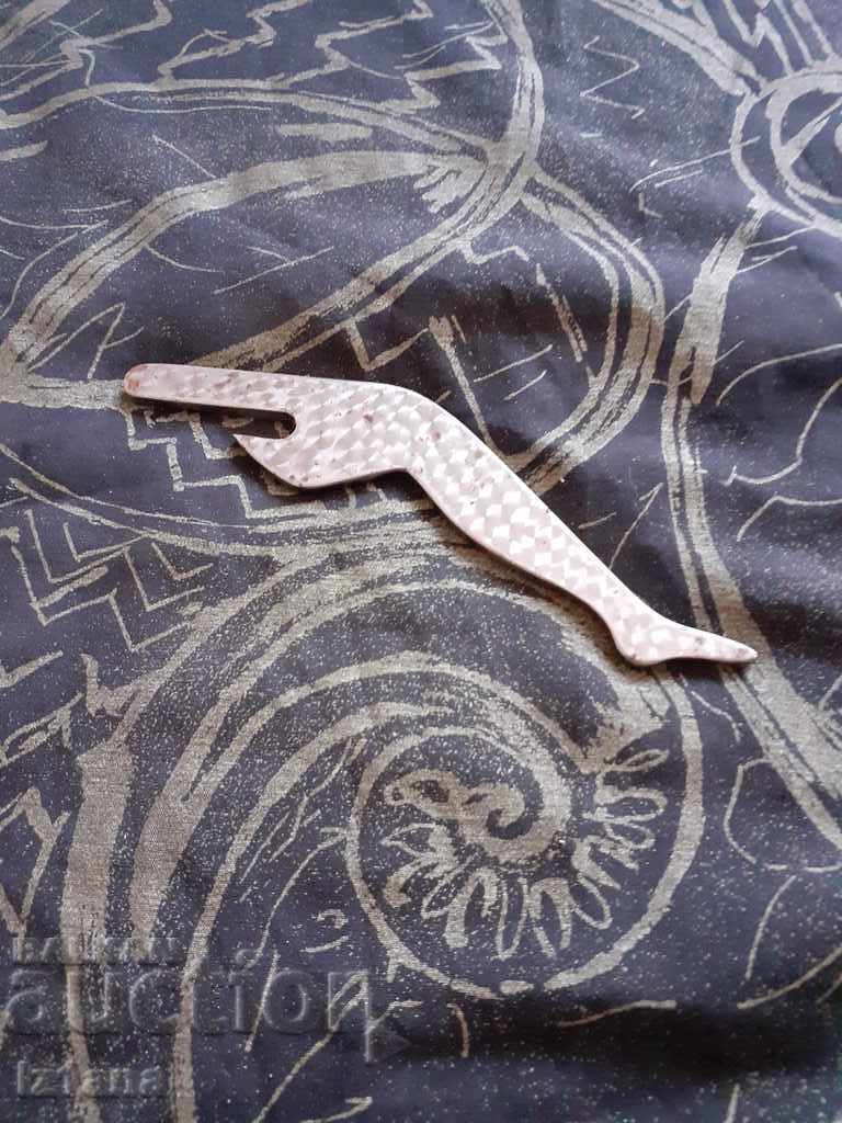 An old bottle opener An old bottle opener