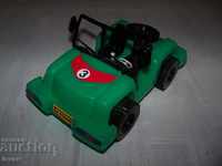 Green plastic buggy social toy in excellent condition