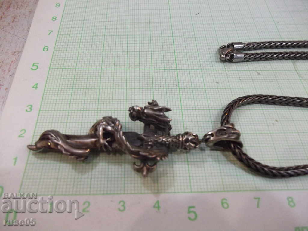 Auction Pendant "Dragon around a cross" with a silver chain - 53.42 g. Auction Pendant "Dragon around a cross" with a silver chain - 53.42 g.