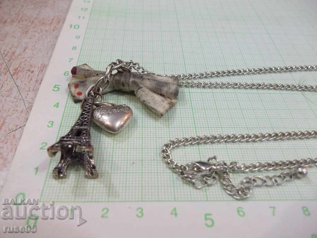Auction Pendant "Eiffel Tower and heart" with a chain Auction Pendant "Eiffel Tower and heart" with a chain