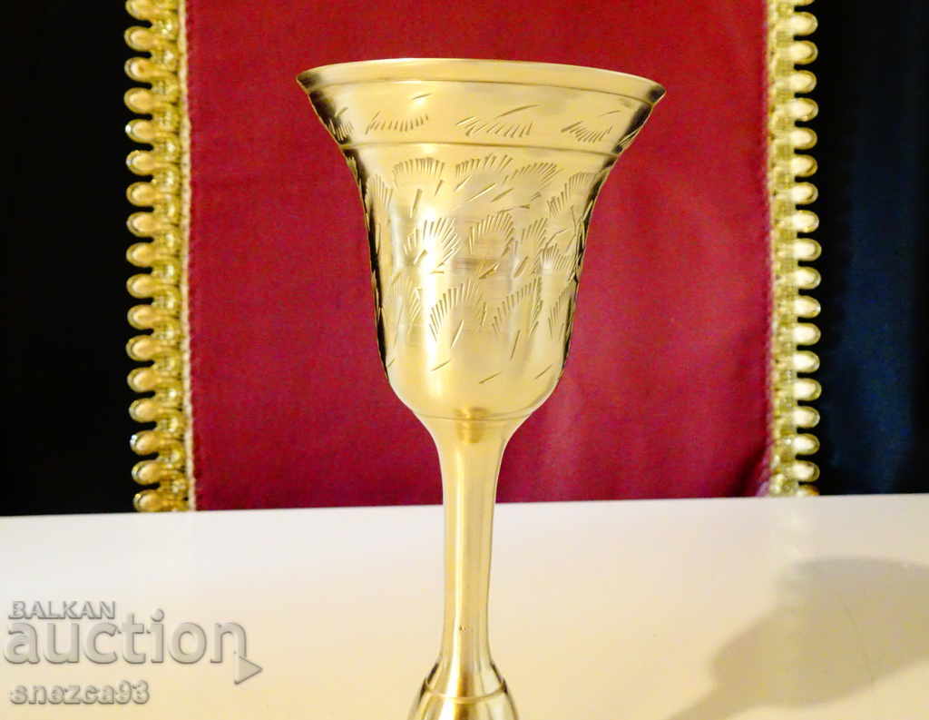 Auction Both bronze goblet, wine glass, and candlestick Auction Both bronze goblet, wine glass, and candlestick