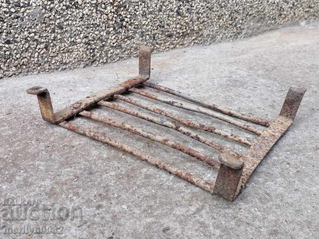 Delivery of An old hand-forged grill, a steak, wrought iron Delivery of An old hand-forged grill, a steak, wrought iron