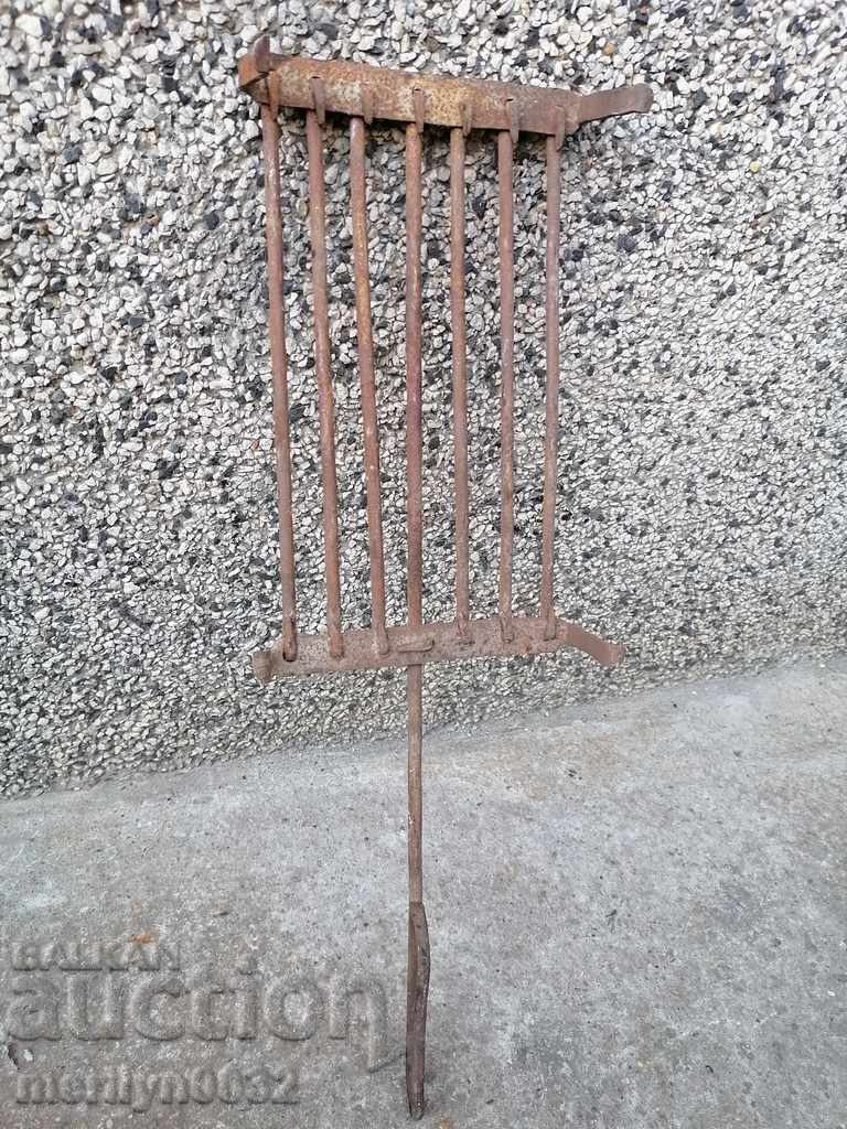 Delivery of An old hand-forged grill, a steak, wrought iron Delivery of An old hand-forged grill, a steak, wrought iron