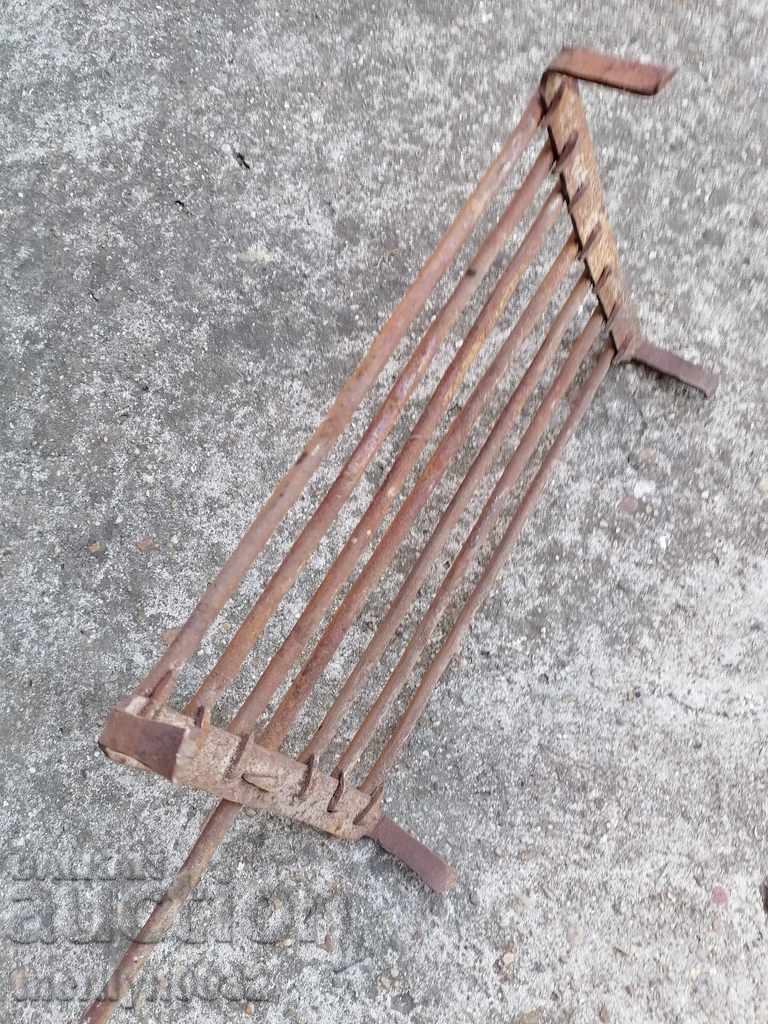 An old hand-forged grill, a steak, wrought iron - 5 An old hand-forged grill, a steak, wrought iron - 5