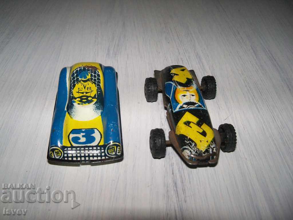 Two small tin carts from the time of the sots