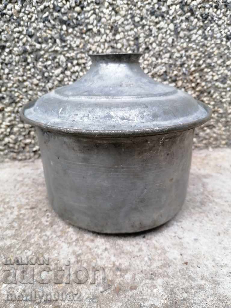 An old tinned pot, a baker's copper pot with lid