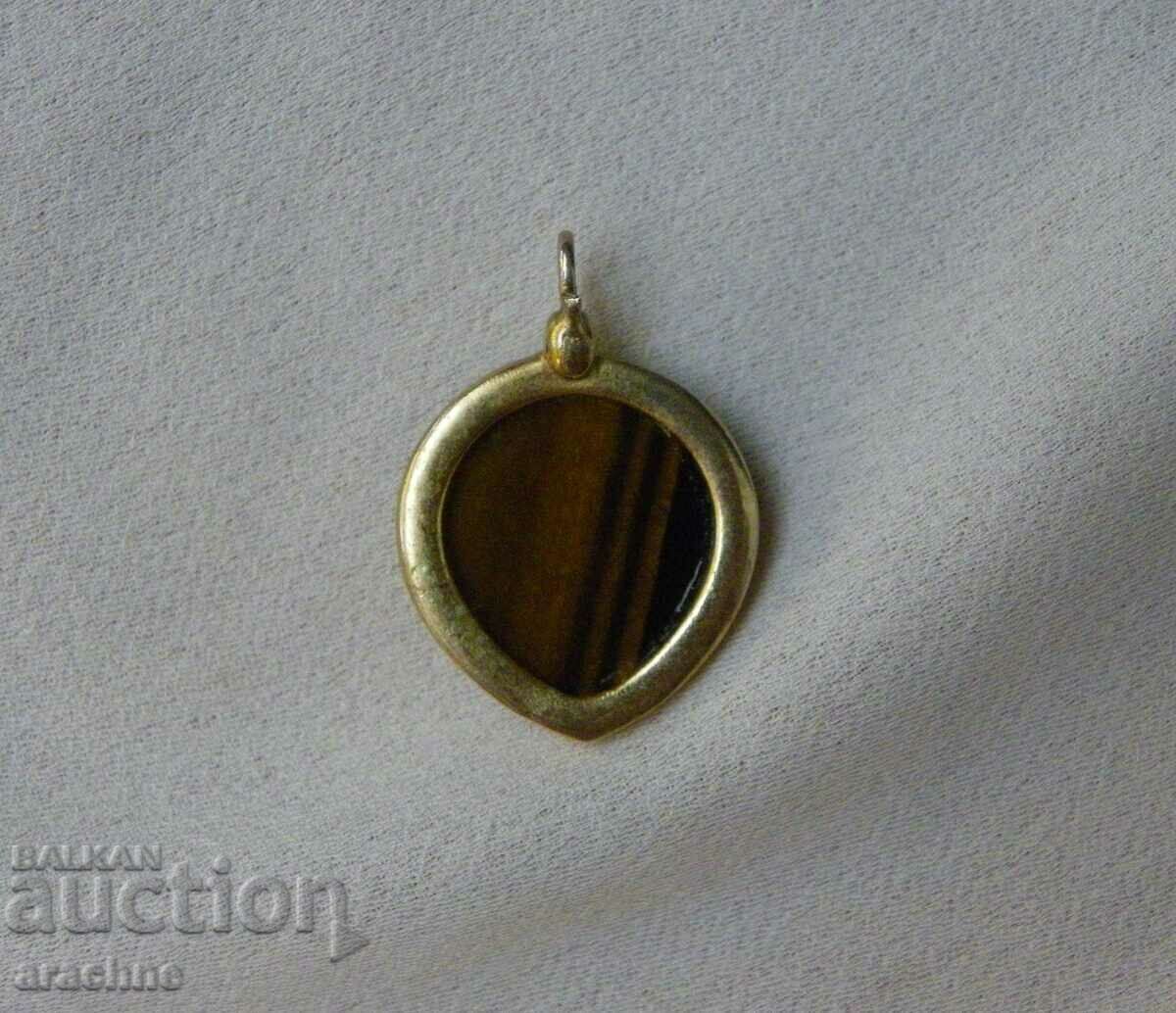 Delivery of Large old silver medallion with a tiger's eye Delivery of Large old silver medallion with a tiger's eye