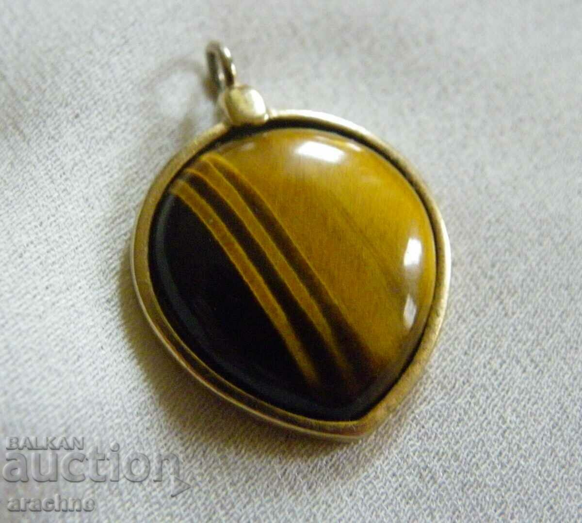 Large old silver medallion with a tiger's eye