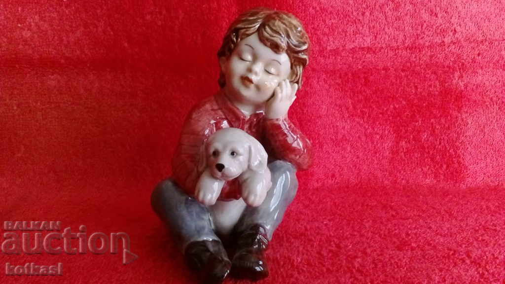 Old porcelain figure Boy with a dog