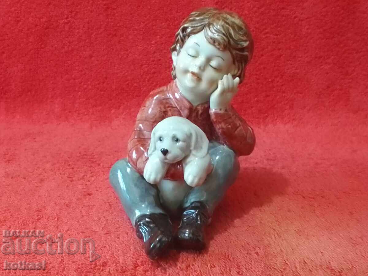 Old porcelain figure Boy with a dog