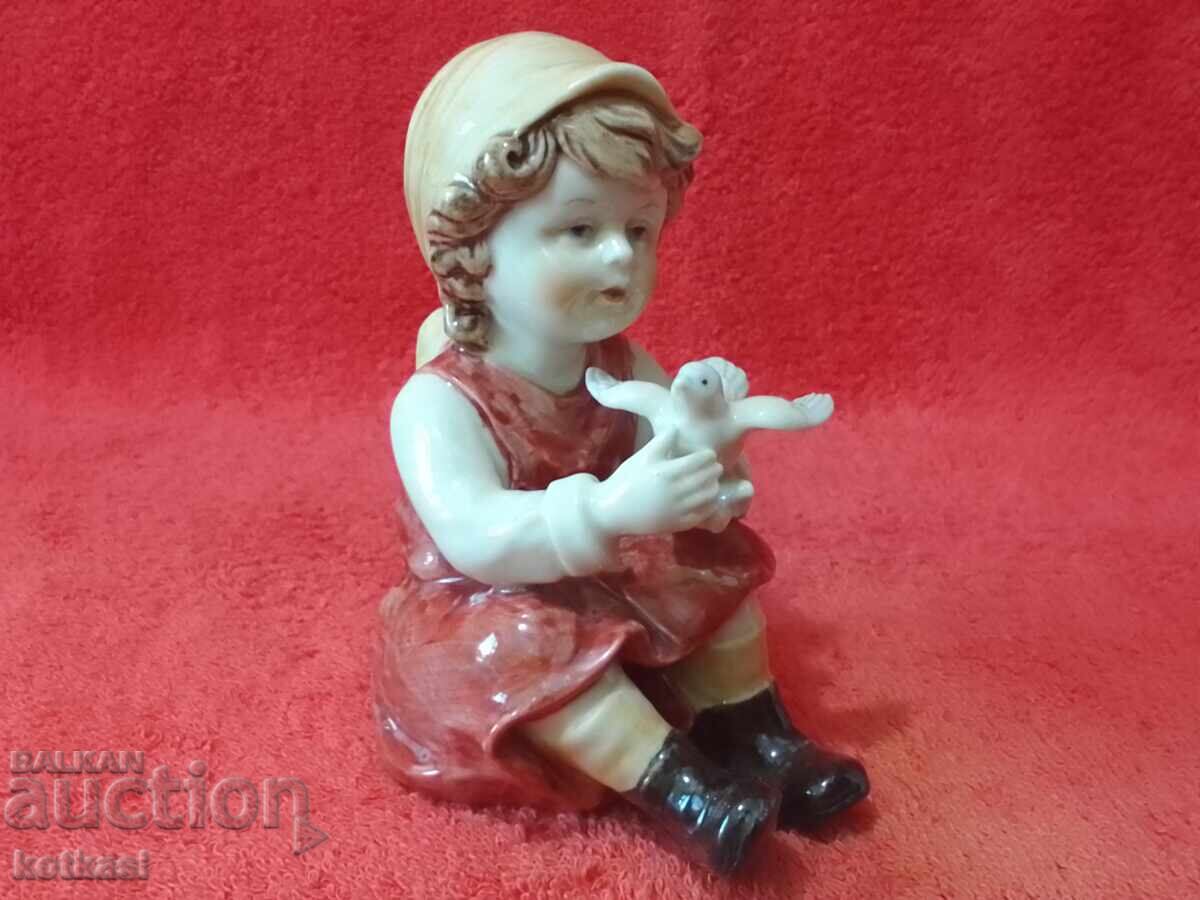 Old porcelain figure Girl with a dove with price 125.50 BGN | € 64.17 Old porcelain figure Girl with a dove with price 125.50 BGN | € 64.17