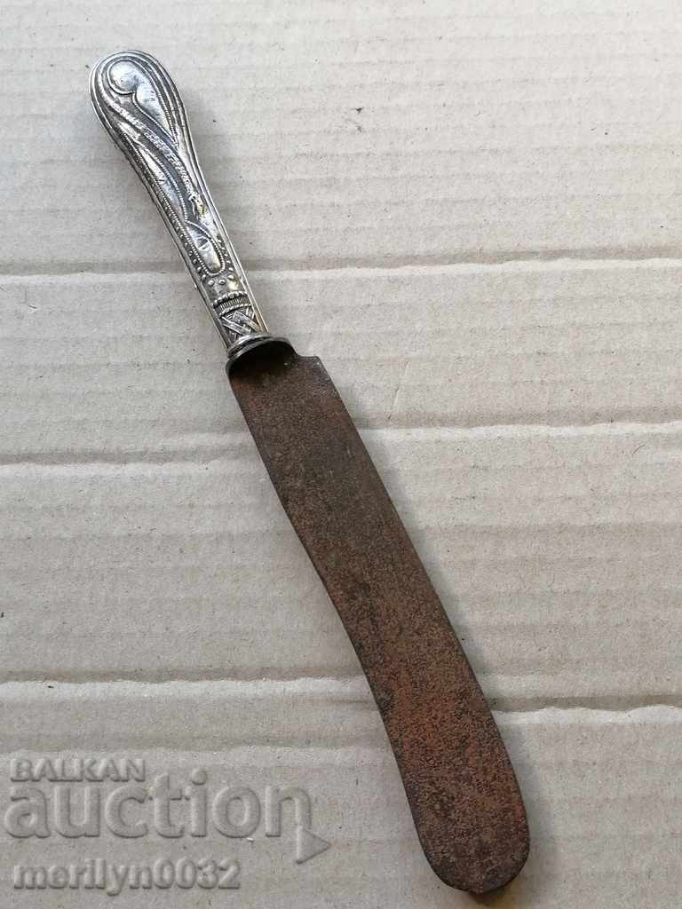 An old knife with a silver handle of grandfather Vladika