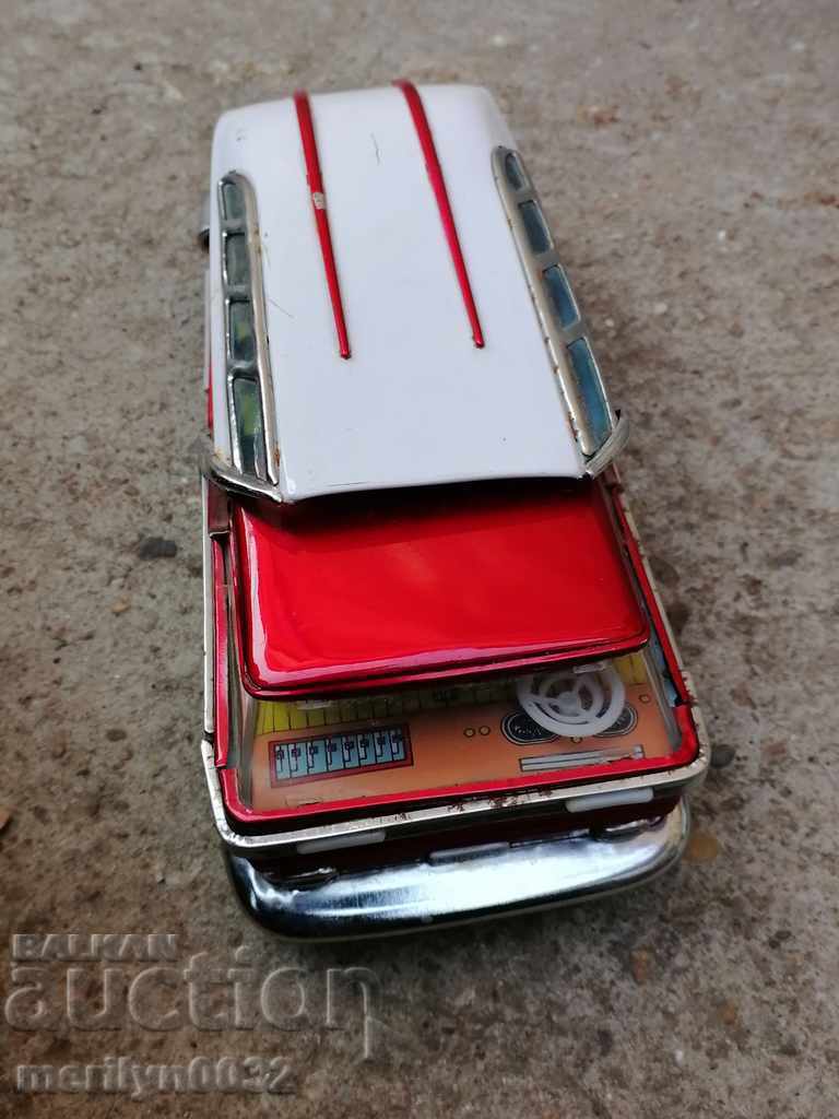 Auction Children's tin toy bus, car, stroller Auction Children's tin toy bus, car, stroller