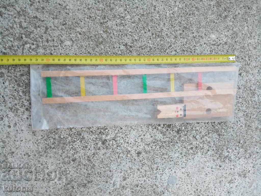 Old wooden toy with price 4.99 BGN | € 2.55 Old wooden toy with price 4.99 BGN | € 2.55