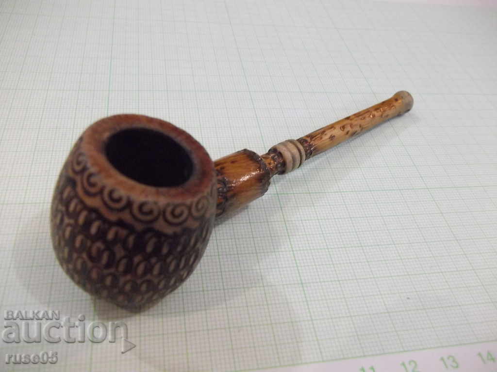 A pipe pyrographed by the soc - 5 A pipe pyrographed by the soc - 5